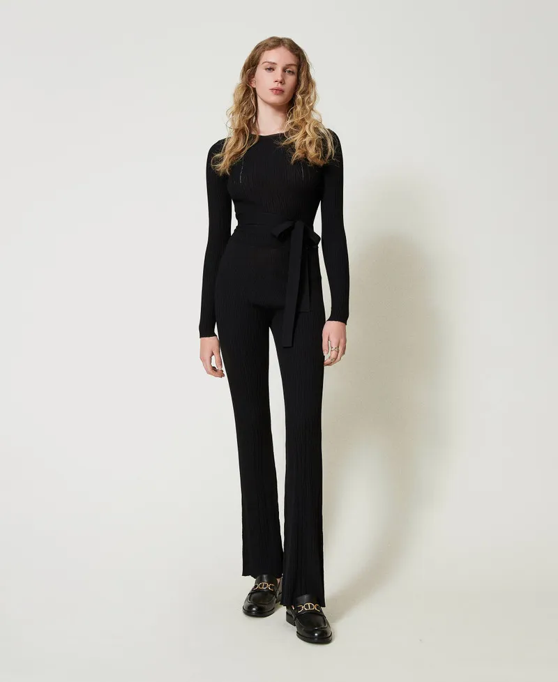 Pantaloni flare in maglia a costine